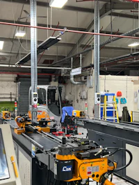 Photo of industrial electrical installation with electrical supplies for machines mounted to cable tray
